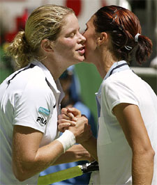 Kim Clijsters of Belgium kisses Anastasia Myskina of Russia