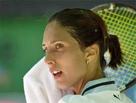 Anastasia Myskina of Russia wipes her face in a break during her quarterfinal match against Kim Clijsters of Belgium 