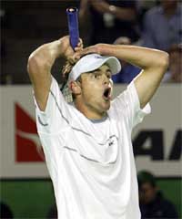 Andy Roddick of the United States reacts to a line call during his five hour marathon quarterfinal match against Younes El Aynaoui of Morocco