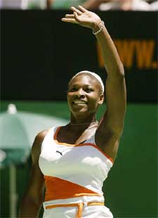 Serena Williams of the USA waves to the crowd after defeating Meghann Shaughnessy