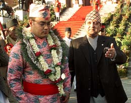 King Gyanendra of Nepal escorts his would be son-in-law Kumar Raj Bahadur Singh at the Narayanhiti royal palace in Kathmandu