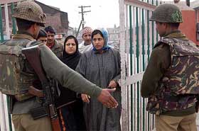 Paramilitary personnel guard the entrance of a hospital