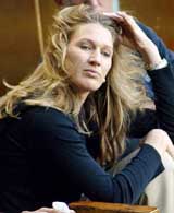 Tennis great Steffi Graf watches her husband Andre Agassi of the United States play Wayne Ferreira of South Africa 