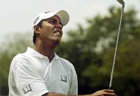 Indian golfer Arjun Atwal watches a fairway shot
