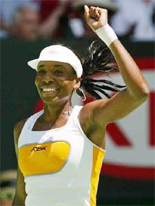 Venus Williams of the United States celebrates her win over Justine Henin-Hardenne of Belgium
