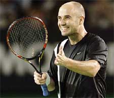 Andre Agassi of the United States celebrates his win over Wayne Ferreira