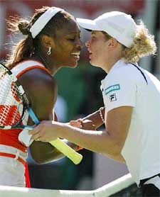 Serena Williams consoles her opponent Kim Clijsters
