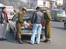 Security personnel check vehicles at Jammu on Friday