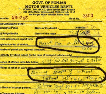 A copy of the challan issued to a Sikh driver for not wearing a helmet while driving a car!