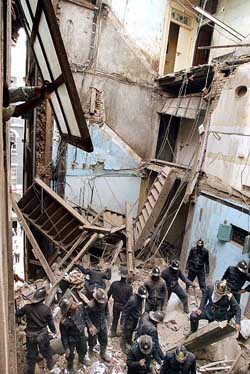 Firemen search for survivors after a five-storey building collapsed in Mumbai 