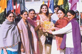 Kimi Aggarwal, film actress and former student of Guru Hargobind Public Senior Secondary School, Sidhwan Khurd, being honoured by staff members