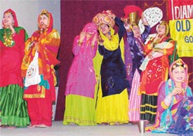 Students of Government College, Malerkotla, take part in a folk dance competition during the diamond jubilee celebrations of the Old Students Association of Government College