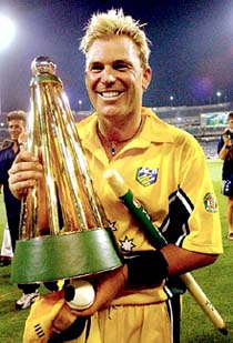Shane Warne of Australia holds the winner's trophy after his side's victory over England in the triangular one-day series final 