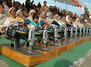 Women waiting for their turn for getting sewing machines on Republic Day 
