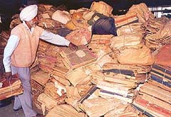 Archival records stacked in the State Languages Department building