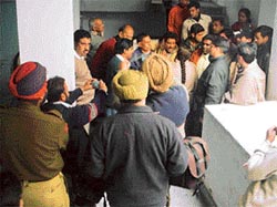 A vigilance team argues with the authorities at Government Girls School at Motchpura Market