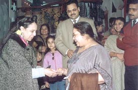 Dr Aruna Bruta giving away prizes on the  fourth anniversary of  Pink Pearls