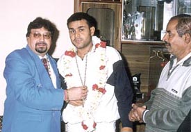Cricket hero Virender Sehwag being felicitated by Dr Shiv Raj, head of the Gobhania Nirog Dham