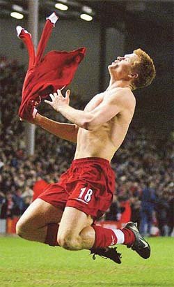 Liverpool's Norwegian defender, John Arne Riise celebrates after scoring
