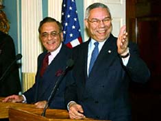 US Secretary of State Colin Powell and Pakistan Foreign Minister Khurshid Mahmud Kasuri share a light moment with mediapersons 