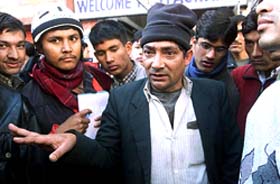 D.R. Lamichane, an appointed negotiator for the Maoist rebels, talks to the press in Kathmandu 