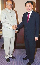 Deputy Prime Minister L.K. Advani shakes hand with Thailand’s Prime Minister Thaksin Shinawatra at Government House in Bangkok