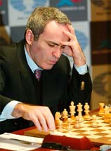 Chess grandmaster Garry Kasparov studies the board while playing against the chess supercomputer, Deep Junior
