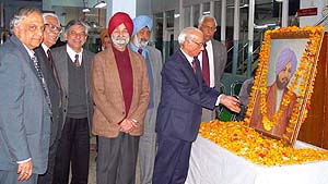 Justice R.S.Pathak , President of The Tribune Trust, pays floral tribute to the portrait of Sardar Dyal Singh Majithia, founder of The Tribune, in Chandigarh