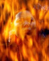 A Chinese worshipper prays at a Daoist temple