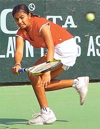Vandana Murali of India dodges past her opponent Nusrat Baishak of Bangladesh in the girls singles event at the ITF junior ranking tennis tournament which began in Chandigarh