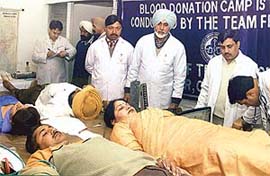 Members of the Punjab Financial Corporation Employees Welfare Association donate blood at a camp to mark the golden jubilee of the corporation in Sector 17, Chandigarh