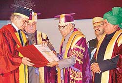 The Chancellor of Kurukshetra University, Babu Parmanand, confers the Hon. D. Lit degree on Union Tourism Minister Jagmohan at Kurukshetra on Tuesday.