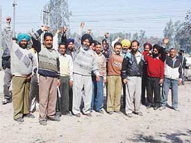 PSEB employees raise slogans against the move to privatise power services in the state