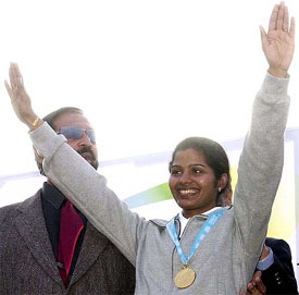 Sunita Rani waves to the crowd after she was re-crowned by the Olympic Council of Asia 