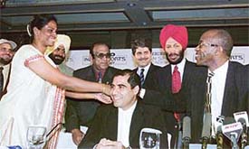 Legendary athlete and chairman of Laureus World Sports Academy Edwin Moses being welcomed by sprint-queen P.T. Usha at the press conference