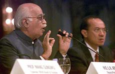Deputy Prime Minister L. K. Advani answers questions from the audience while Singapore Trade Minister George Yeo listens during a public lecture organised by the Institute of South East Asian Studies in Singapore on Tuesday.