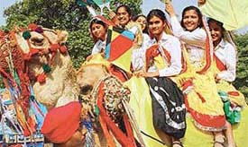 Young dancers take a camel ride during Basant Utsav which opened at Leisure Valley, Sector 10