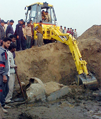 The aircraft wreckage being dug out from the Markanda river