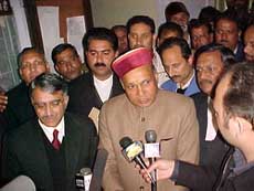 Chief Minister P.K. Dhumal addresses the media after filing a case of defamation against Capt Amarinder Singh and others