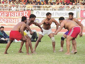 A kabaddi match between England and Germany in progress during the sixth Lodhi Cup Kabaddi Tournament at Guru Nanak Stadium