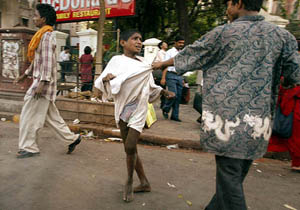 A local bully roughs up a street child