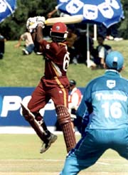 West Indies batsman Wavell Hinds takes a swipe at the ball