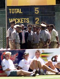 Zimbabwe policemen get instructions at the Harare Sports Club