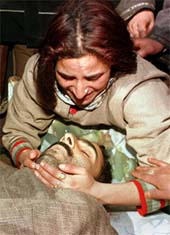 The sister of Bilal Ahmad cries over his body