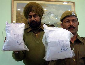 Custom officials show seized heroin at a Press conference in Amritsar