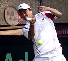 Goichi Motomura of Japan making a forehand return
