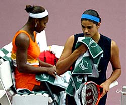 Eleni Daniilidou of Greece passes Serena Williams of the USA 