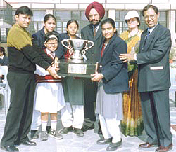 Jaspal Kaur Public School receiving the CBSE National Table Tennis senior girl's trophy.