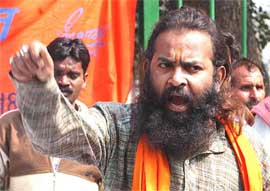 A Shiv Sena activist raises slogans against the Pakistan President, Gen Pervez Musharraf, during a demonstration