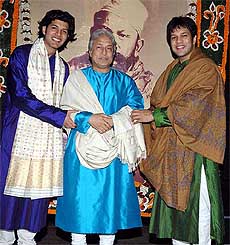 Sarod maestro Ustad Amjad Ali Khan poses with sons